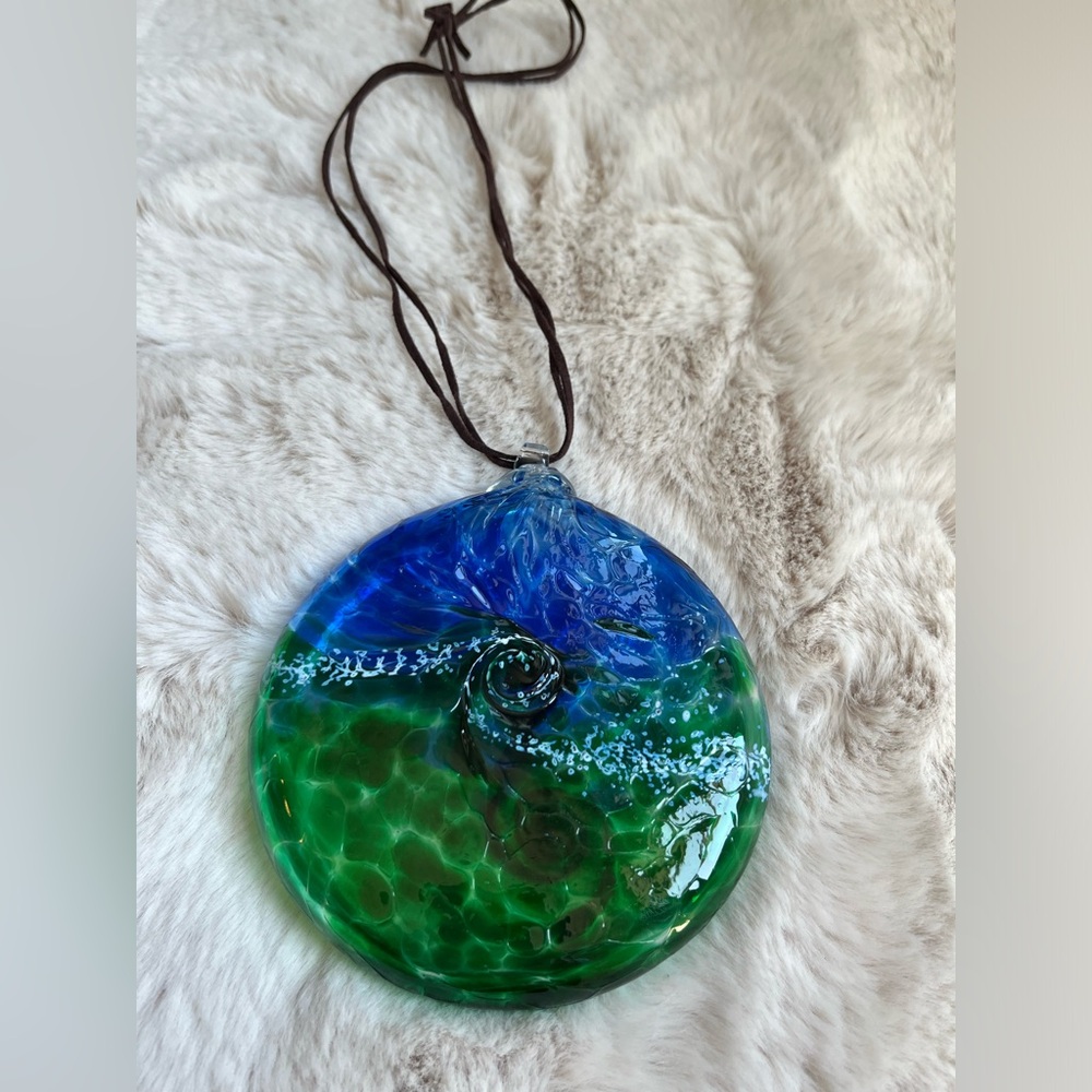 Large glass art decor.  Blue and green.